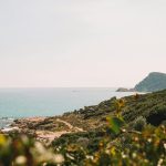Stunning view of a rugged coastline in Fréjus, Provence, with clear skies and tranquil sea.